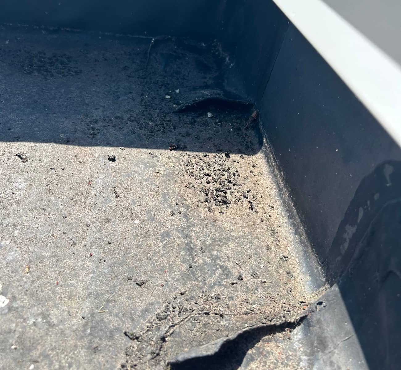 damaged flat roof with open holes