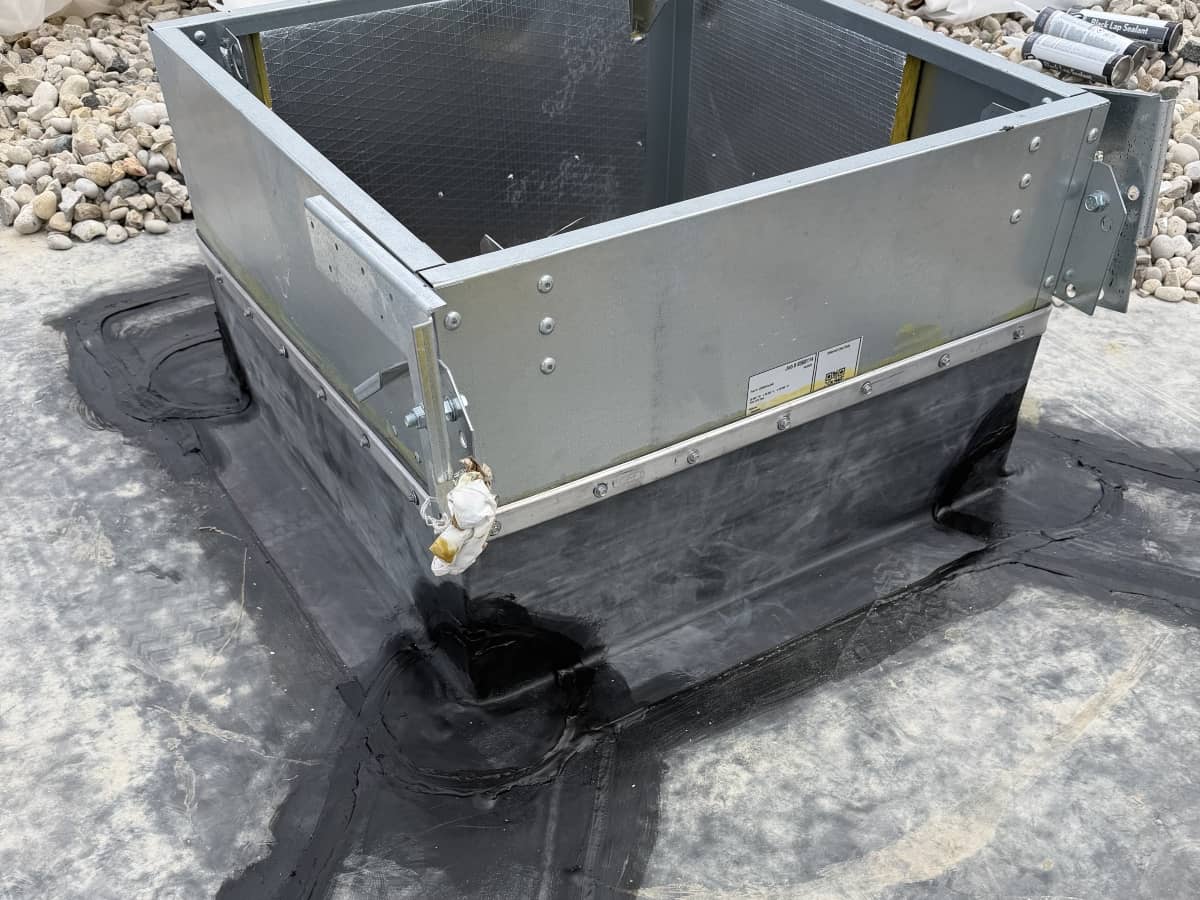 HVAC equipment curb with black flashing