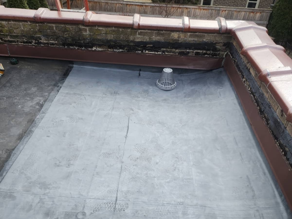 flat roof repair with gray single ply membrane