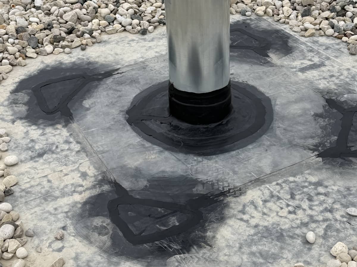 metal pipe leak repair with new flashing installed